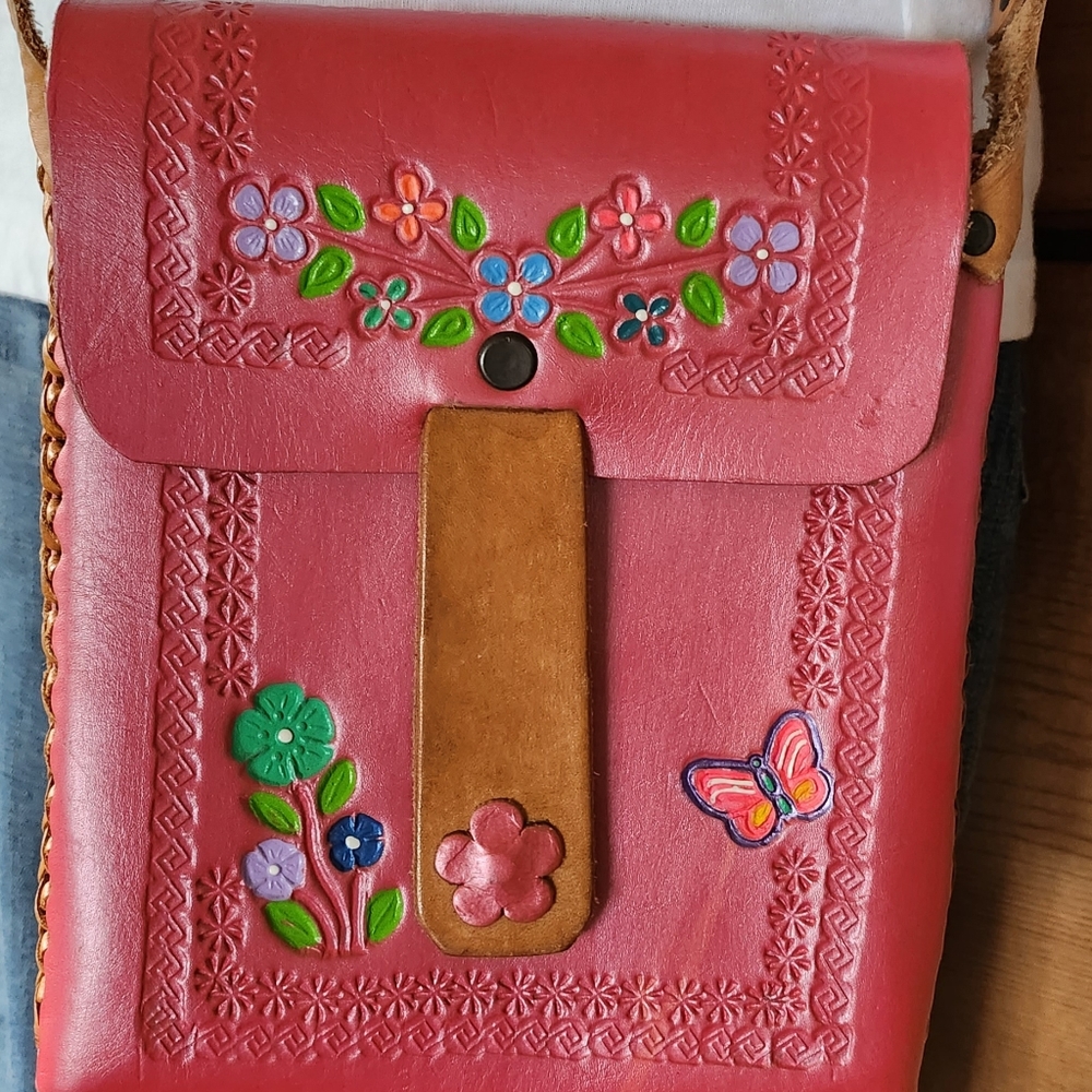 Pink Leather Cross-body Bag with Floral Design and Custom Stitching.